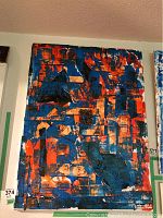 Front view of the abstract painting by Alex Hare in dominant orange and blue colors