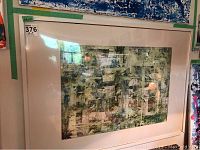 Framed abstract art with textured collage and mixed green, white, and black tones.