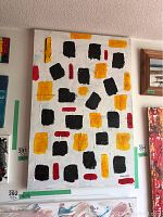Front view of the unframed abstract painting showing black, yellow, and red blocks on white textured background, signed by Alex Hare.