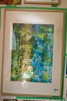 Full frontal view of the framed abstract artwork showing colors and texture.