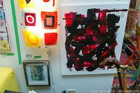 Photo showing the unframed abstract painting by Alex Hare with black and red brush strokes on white background, 24x20 inches.