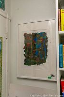 Framed abstract painting by Alex Hare hanging on a wall near a doorway and bookshelves. Various angles show the size, framing, and colors of the artwork.