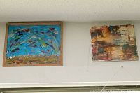 Both paintings displayed on a wall showing general composition and relative size.