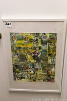 Full view of the framed abstract painting showing the overall composition and colors.