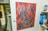 Full view of the abstract oil painting hung on a white wall from a distance showing the complete canvas.