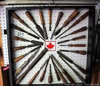 Front view of radial display on pegboard with all chisels mounted