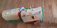 Two Fisher Price Family Play Farm vintage barn toys joined together, showing side and top views with carrying handles.