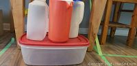 Plastic jugs and storage containers stacked together