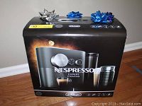 Sealed DeLonghi Nespresso Expert & Aeroccino3 box with decorative bows on top