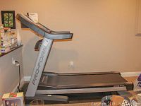 Side angle of ProForm Pro 2500 treadmill showing model number and console