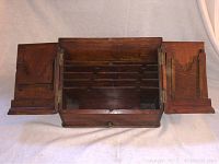 Top view showing the letter holder open with multiple internal dividers and fold-out side panels expanded for extra storage compartments.