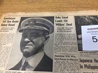Close-up of front page showing headline 'Eyewitnesses: How Bombs Raked Hawaii' with a photograph of a military official.