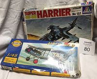 Two plastic model airplane kits side by side: Italeri Super AV-8B Harrier and Smer Airco DH.2 in original boxes showing artwork and wear.