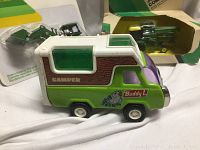 Buddy L original camper toy with green, white, purple coloring, and woodgrain style decals.