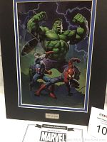 Frontal view of the Marvel laser cell print showing Hulk, Captain America, and Spiderman with certificate numbered 287 of 500.