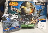 Three Star Wars Hot Wheels items including Rogue One vehicle, Death Star Battle Blast playset and Jar Jar Binks figure