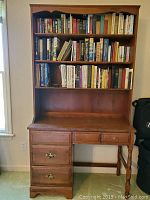 Front view of Moosehead Rock Maple student desk with hutch filled with books.