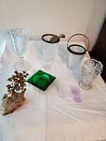 All items arranged together showing the variety of crystal, glass and stone items described.