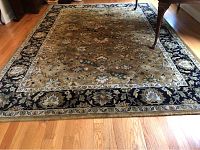 Full view of the wool area rug showing overall pattern and size in room