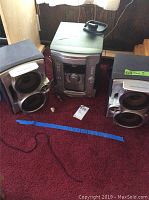 Full stereo system with main unit and two hybrid dual woofer speakers, showing overall items for sale