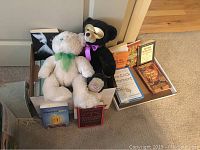Box of two stuffed bears and several hardback and paperback books including by Rowling, James, Woodward.