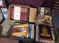 Photo of multiple boxed books arranged including Builders Library series and others on home repair, tile setting, engineering, and construction.