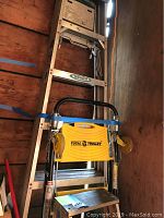 Photo showing 6 ft aluminum ladder and Total Trolley stacked together