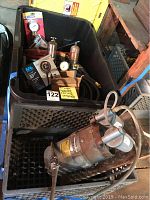Gast vacuum pump with attached hoses and other items in crates