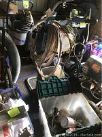 Main image showing Kremlin Airmix sprayer system on a metal cart with attached hoses and accessories, along with a plastic bin containing smaller parts.