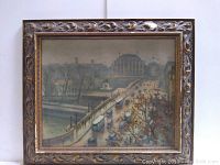Front view of framed painting showing city street and bridge scene with vehicles and pedestrians.
