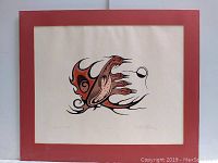 Front view of the Indigenous bird print mounted with red border