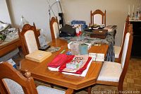Overall view of two armchairs at table ends and four side chairs around table