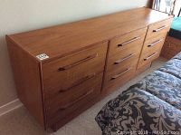 Front view showing nine drawers in three columns