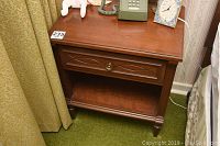 Front view of the Gibbard cherry wood night table showing the drawer and shelf