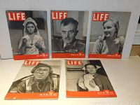 Front view of 5 LIFE magazines displaying covers featuring black and white historical photos of people in early 1940s attire with red LIFE logo and dates in 1940.