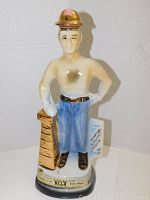 Front view of the Jim Beam decanter showing figure details and base label