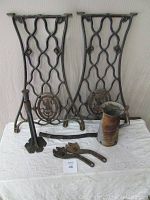 Full lot image showing the two Singer sewing machine legs, Huffman oil can, jack stand and two large wrenches