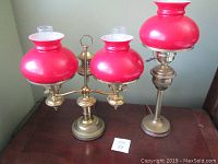 Front view of both lamps: double-arm lamp on left and single lamp on right
