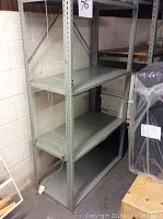 Front-side view of 5-shelf light gray metal shelving unit showing overall size and shelf structure.
