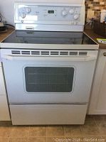 Front view of white Whirlpool freestanding electric range