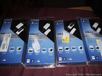 Four Belkin USB 2.0 Premium Printer Cable packages showing front packaging with blue background and black top.