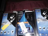 Photo showing the three Belkin cables in their original packaging on a fabric background