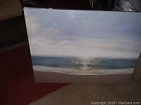 Front view of the ocean landscape painting showing the entire artwork with ocean and sky.