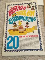 Front cover of the pop-out art decorations book titled 'The Beatles Yellow Submarine' showing colorful retro style design and characters.