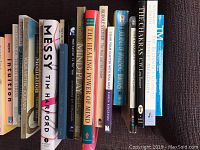 Photo showing 16 self-help and mindfulness books arranged on a surface with titles clearly visible.