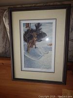 Full view of framed print showing black squirrel artwork