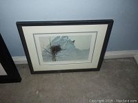 Front view of framed print showing nest and mountain scene