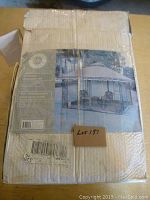 Box packaging for Sunshade mosquito net showing the product name, dimensions (12x10 foot enclosure), and a photo illustration of net installed on an outdoor gazebo.