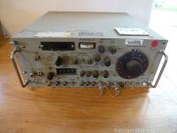 Front view showing analog knobs, switches, signal generator level dial and connectors