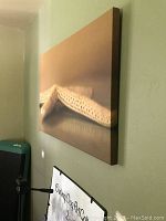 Side view of starfish canvas print mounted on wall, showing depth of stretched canvas.